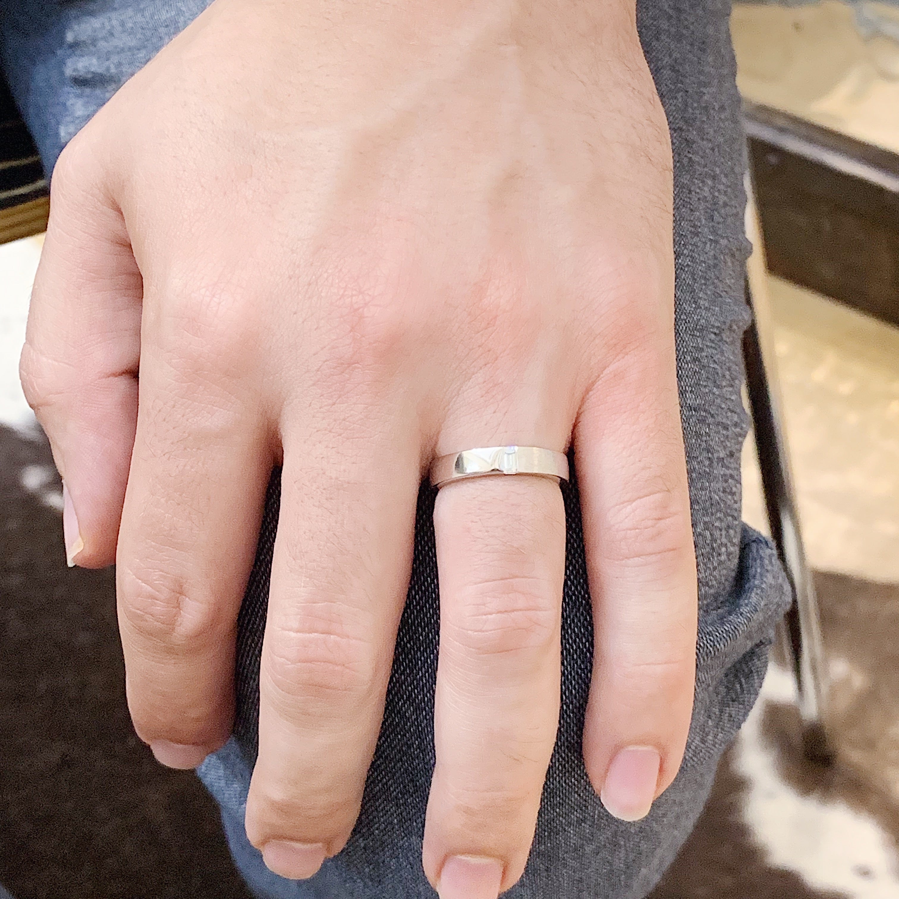 hand with gold wedding band