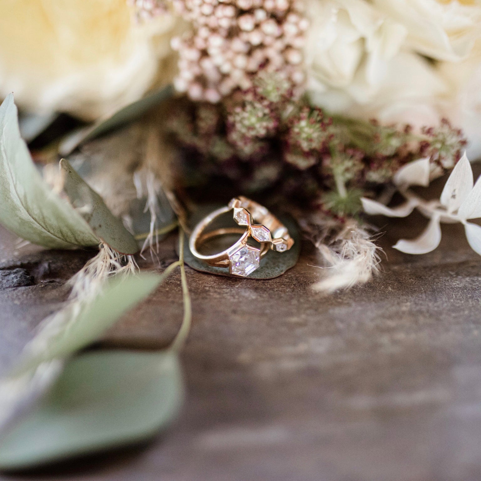 diamond rings on table with flowers