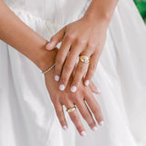 Rings in 14k gold and diamonds by Shahla Karimi on hands