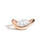A marquise diamond ring with a sculptural rose gold band, presented against a white background.