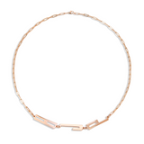 Rose gold necklace with geometric design on a white background