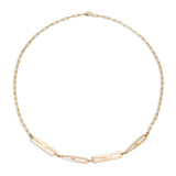 Gold necklace with letter links on a white background