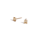 Champagne color cushion diamond studs in yellow gold on white background