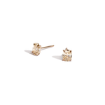Champagne color oval diamond studs in yellow gold on white background