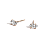 Marquise diamond studs in yellow gold on white background