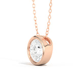 Shahla Karimi pendant in 14K rose gold with round-cut diamond on white background