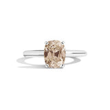 Ring with a brown gemstone on a white background