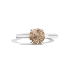Ring with a brown gemstone on a white background