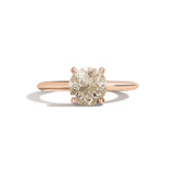 Gold ring with a diamond on a white background