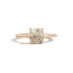 Gold ring with a diamond on a white background