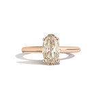 Gold ring with a diamond on a white background