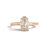 Gold ring with a diamond on a white background