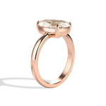 Gold ring with a diamond on a white background
