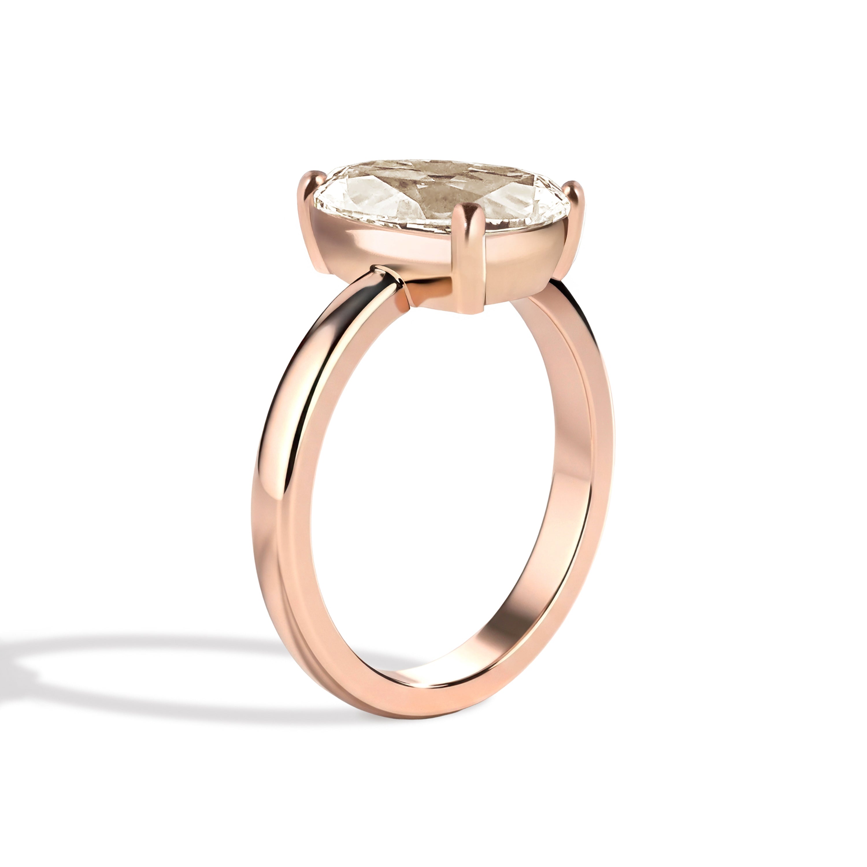 Gold ring with a diamond on a white background
