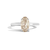 Gold ring with a diamond on a white background