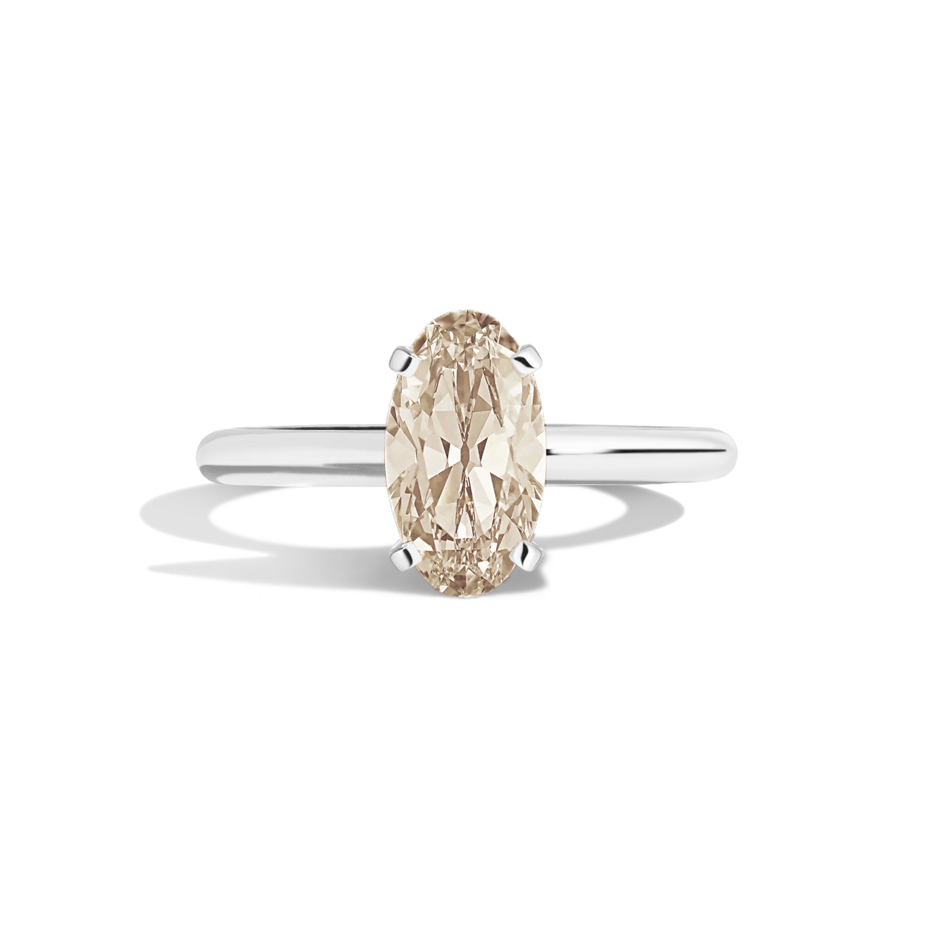 Gold ring with a diamond on a white background