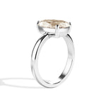 Gold ring with a diamond on a white background