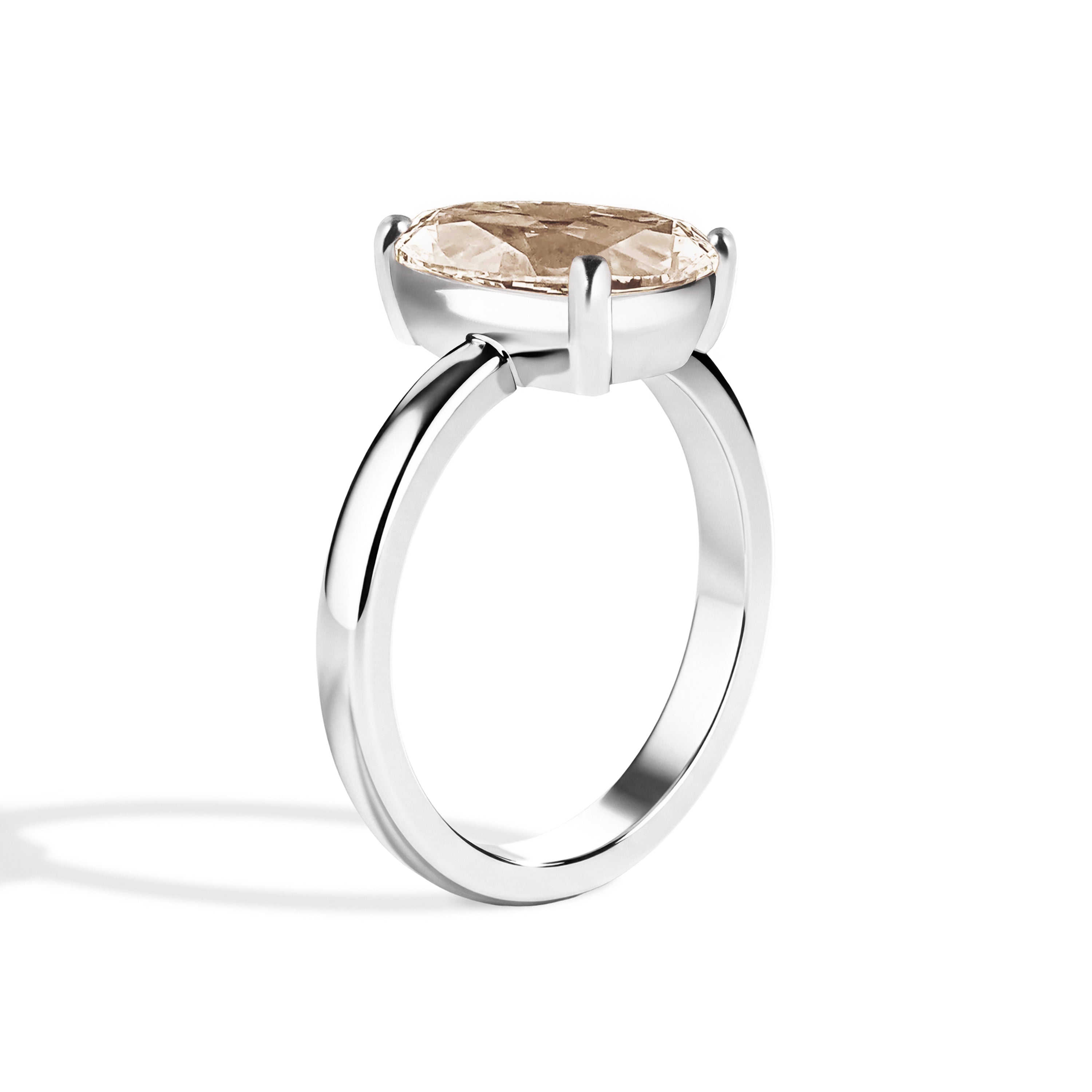 Silver ring with a large gemstone on a white background