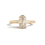 Gold ring with a diamond on a white background