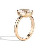 Gold ring with a diamond on a white background