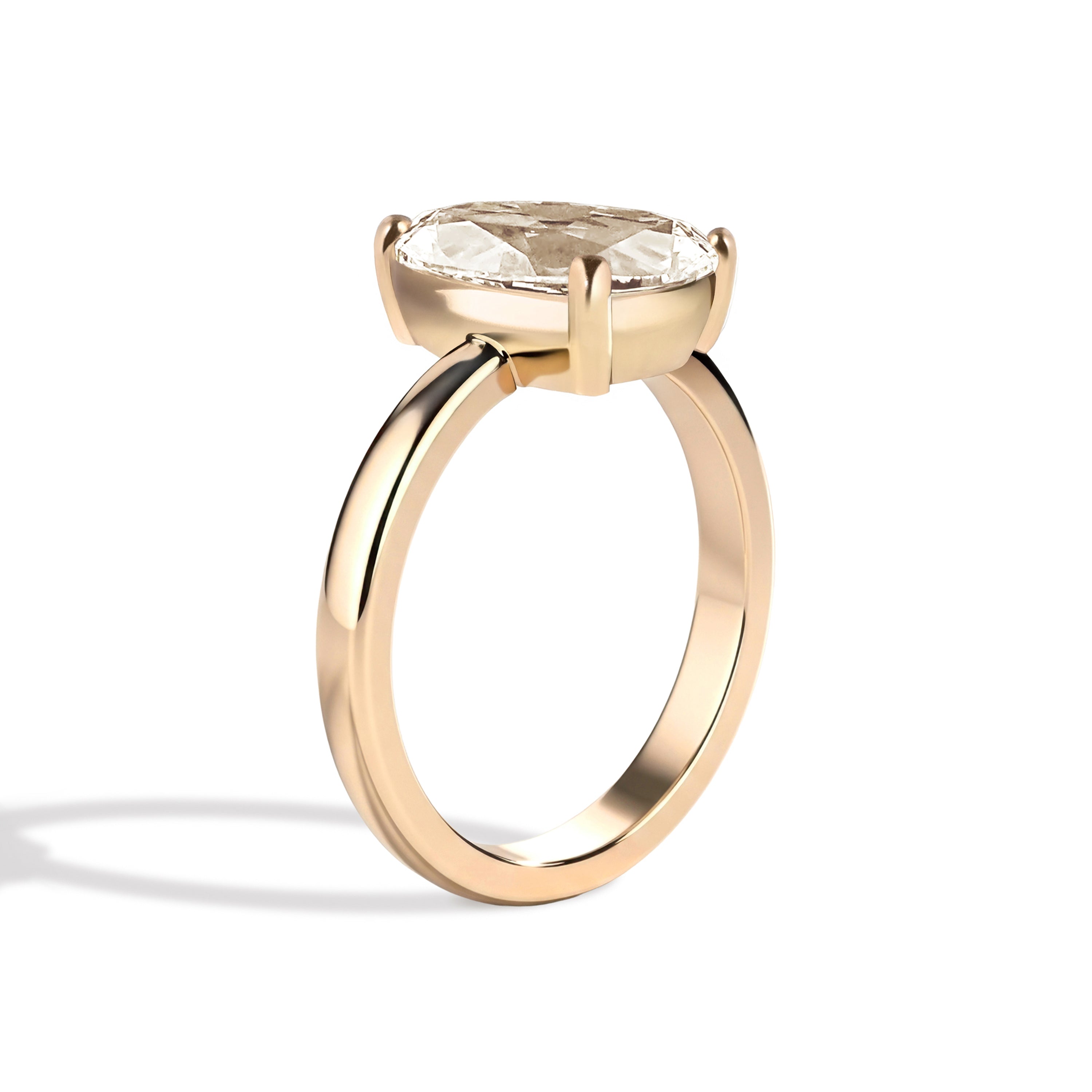 Gold ring with a diamond on a white background