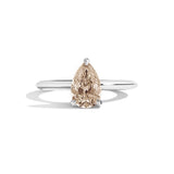 silver ring with a pear-shaped diamond on a white background