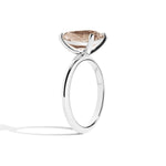 silver ring with a pear-shaped diamond on a white background