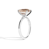 silver ring with a pear-shaped diamond on a white background