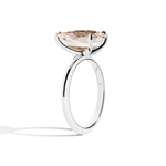 Silver ring with a large diamond on a white background