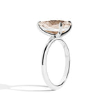 Silver ring with a large diamond on a white background