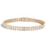 Gold choker with baguette diamonds on a white background