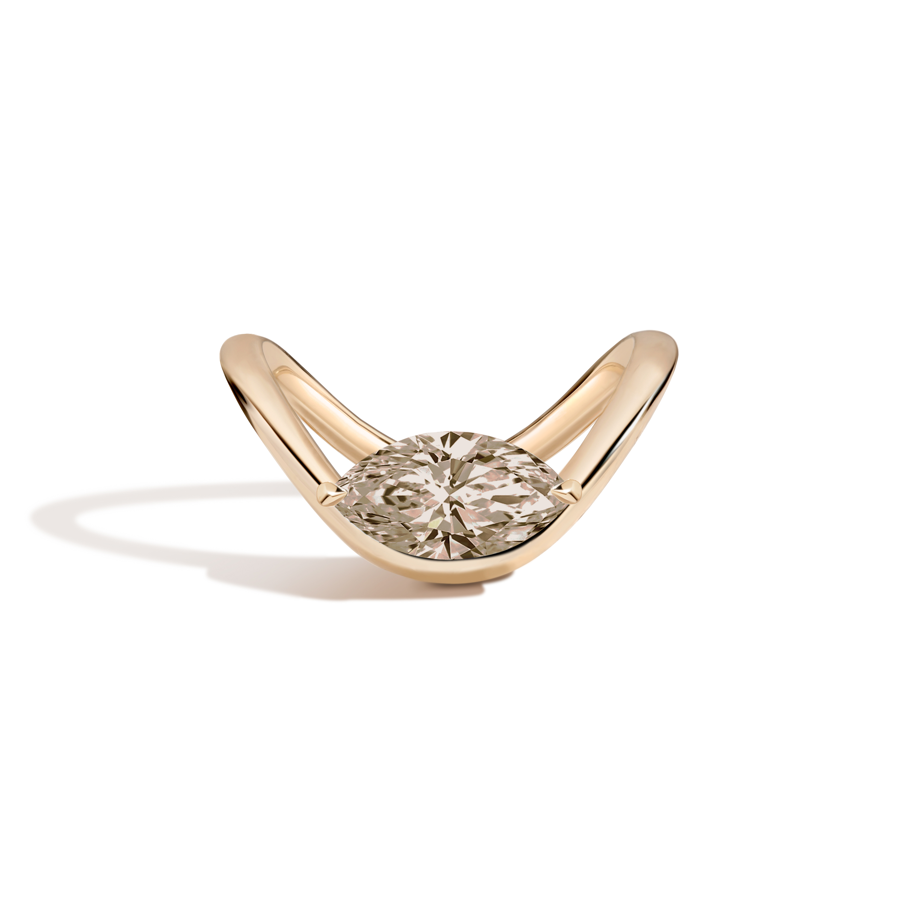 A gold ring with a marquise-cut diamond set on a curved band, shown on a clean white background with a soft shadow.