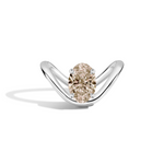 A white gold ring with a unique curved band and a central oval diamond, shown on a clean white background with a soft shadow.