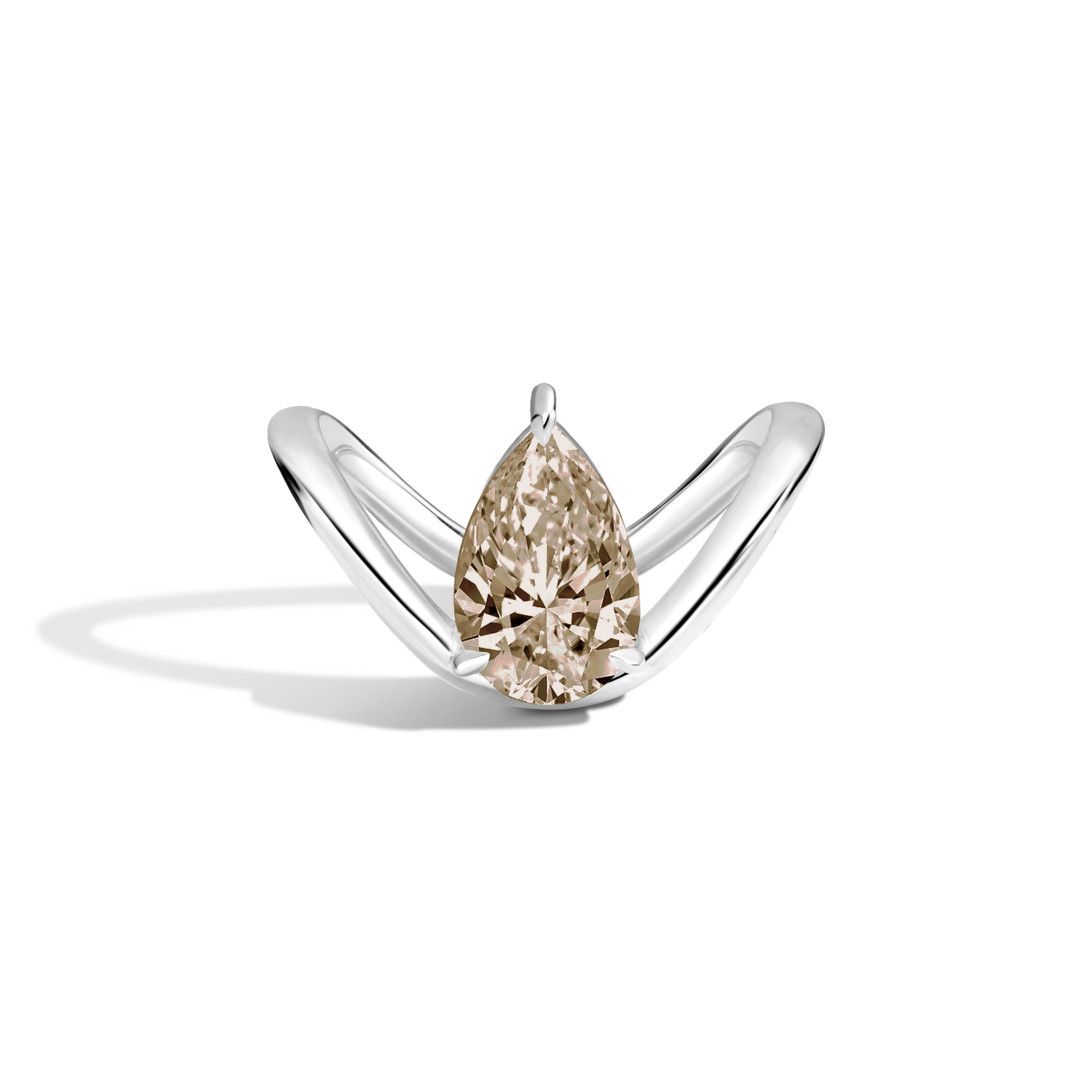 A pear-cut diamond ring set in a polished silver band, photographed on a clean white background with a soft shadow.
