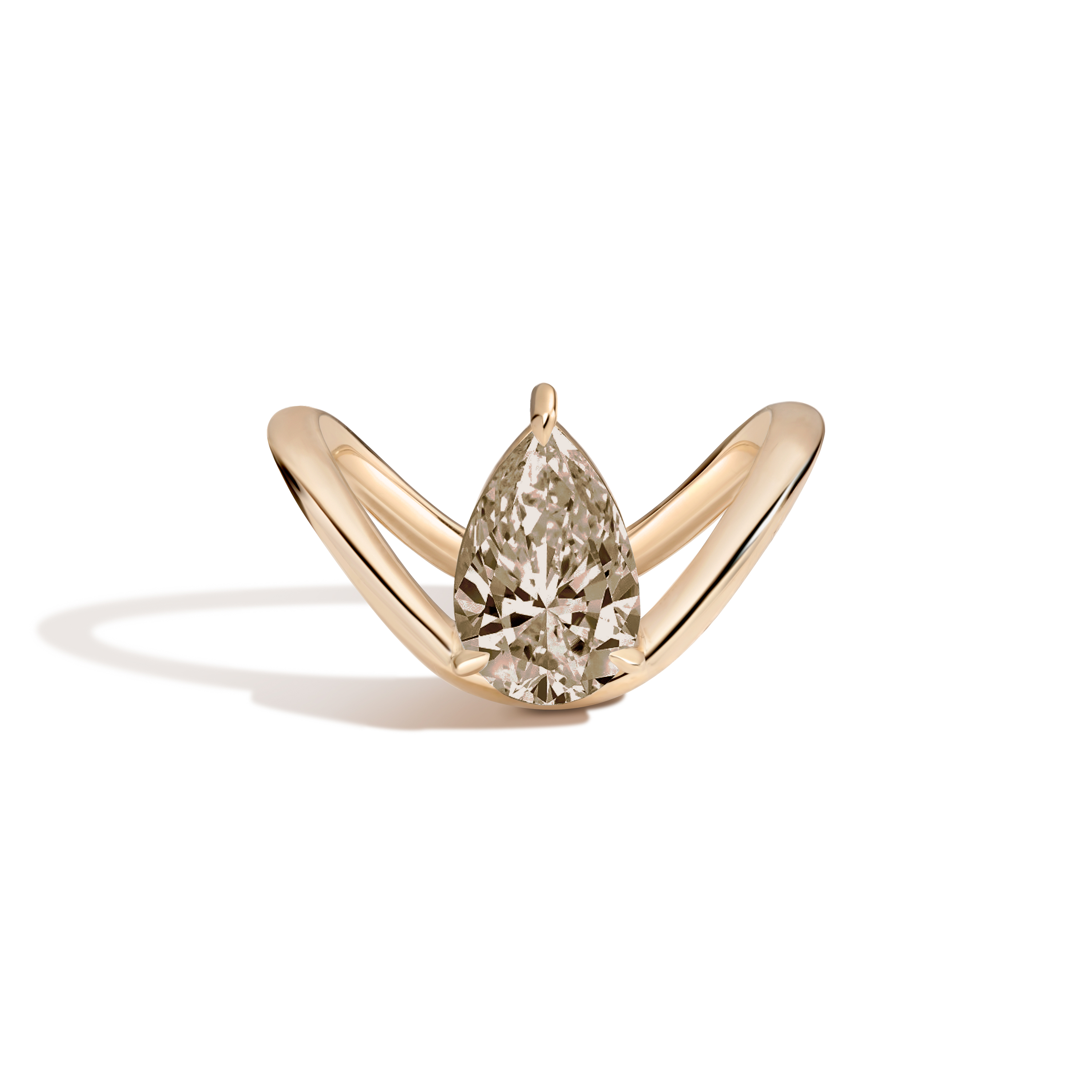 A gold ring featuring a large pear-cut diamond in a curved, open curved setting, photographed on a clean white background with a soft shadow.
