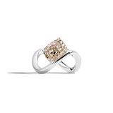 A white gold infinity-shaped ring featuring a tilted cushion-cut champagne diamond center stone, set against a clean white background with a soft shadow.