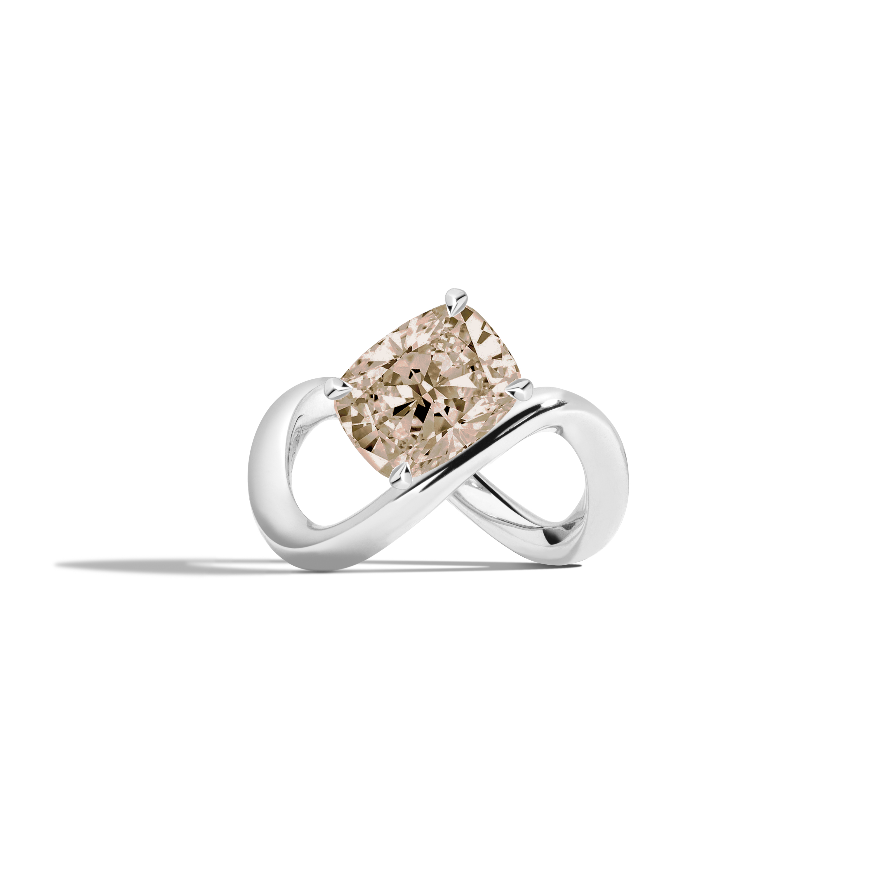 A white gold infinity-shaped ring featuring a tilted cushion-cut champagne diamond center stone, set against a clean white background with a soft shadow.