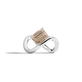 A white gold infinity-shaped ring featuring a tilted emerald-cut champagne diamond center stone, set against a clean white background with a soft shadow.