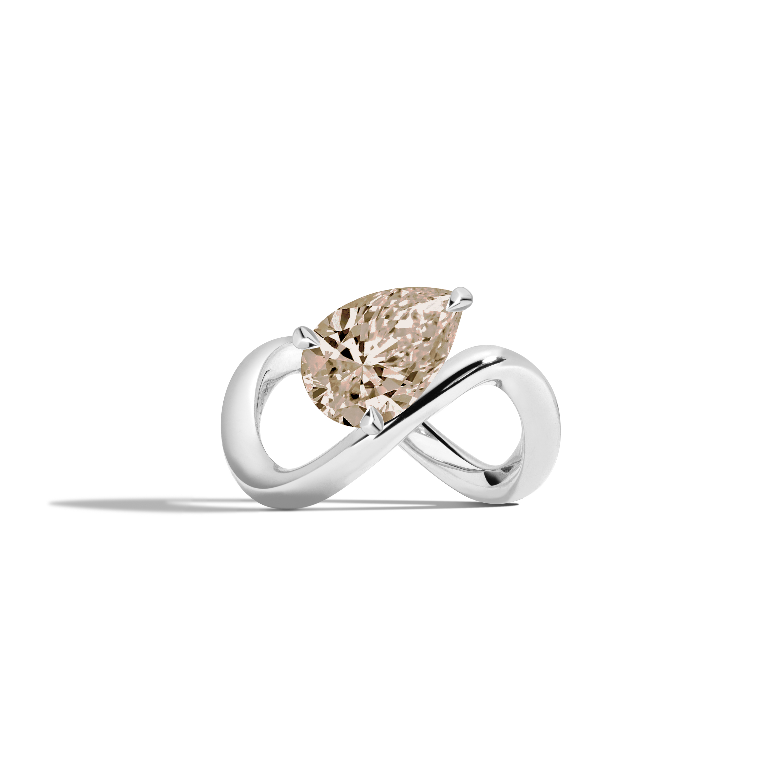 A white gold infinity-shaped ring featuring a tilted pear champagne diamond center stone, set against a clean white background with a soft shadow.