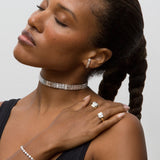 Person wearing 14k white gold diamond choker with yellow and white gold rings, necklace and earring