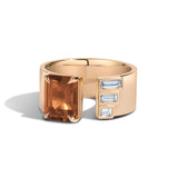 Yellow gold ring with citrine and white baguette-cut diamonds on white background