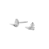 Pair of Shahla Karimi pear-cut studs in 14k white gold on white background
