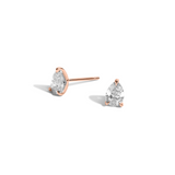 Pair of Shahla Karimi pear-cut studs in 14k rose gold on white background