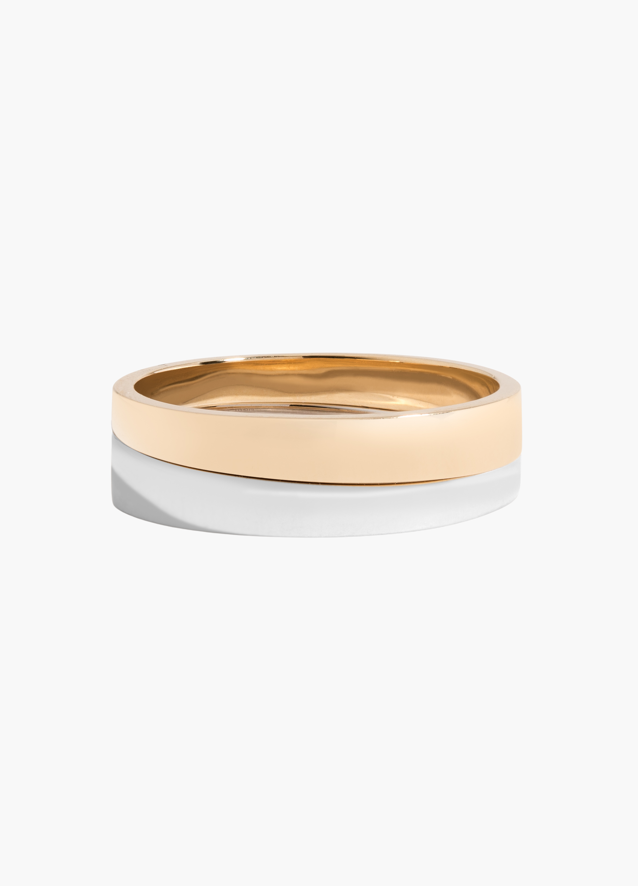 Two-tone gold and silver ring on a white background