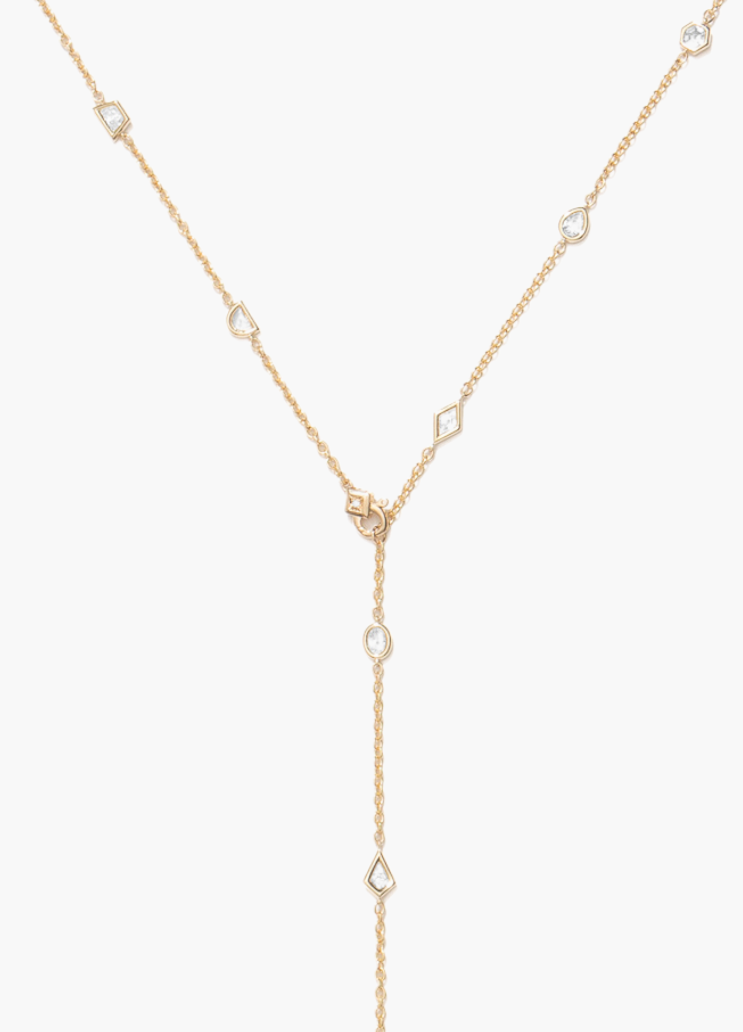 Gold necklace with small diamonds on a white background