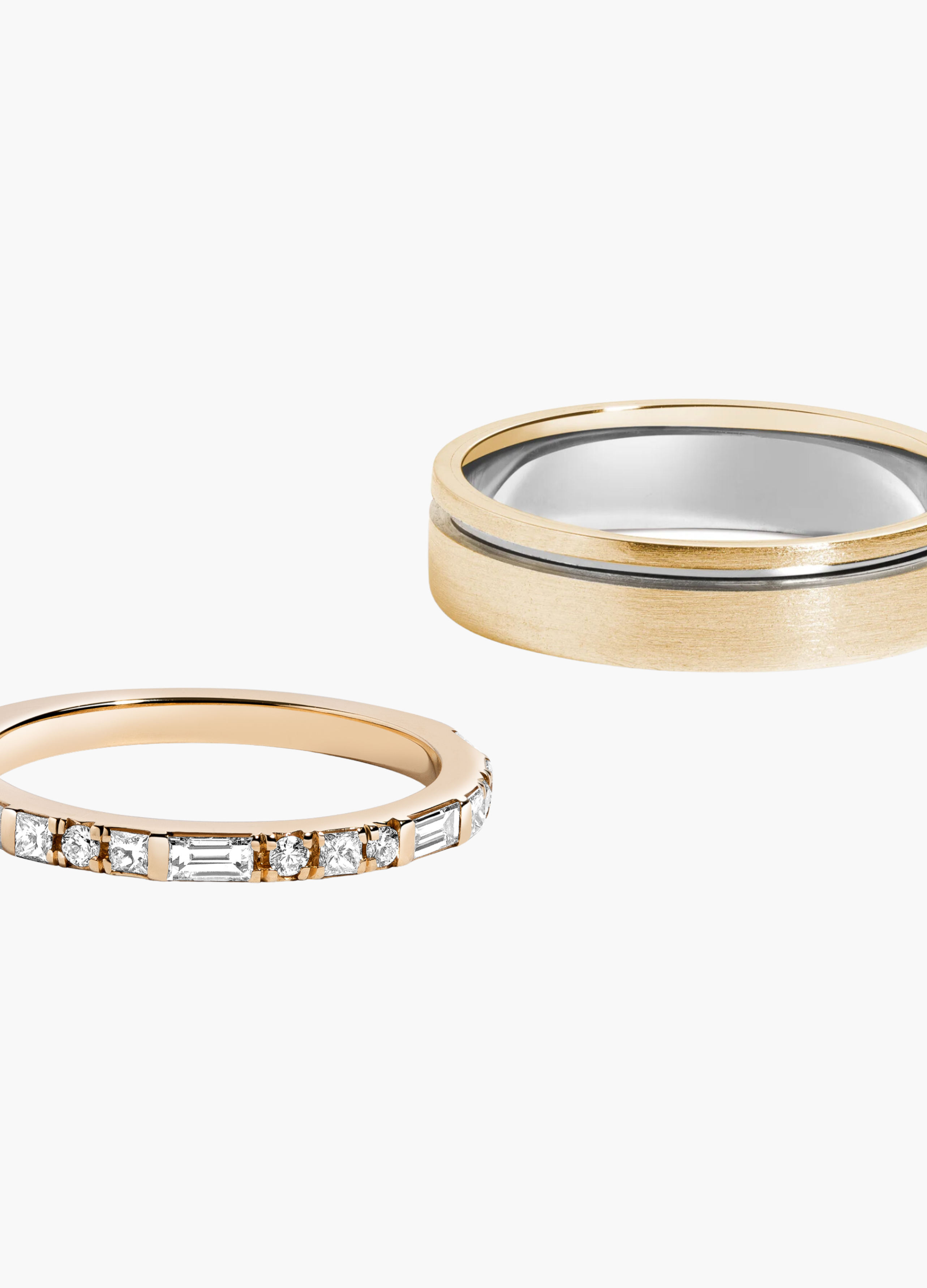 Two gold rings with diamond accents on a white background