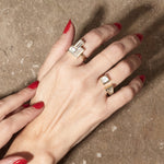 jenga collection rings on hand with textured background