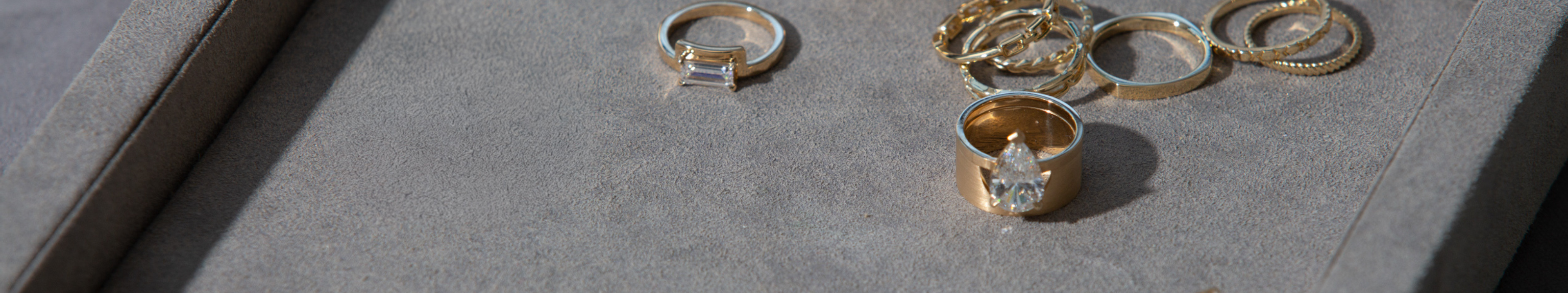 Gold rings on a gray surface