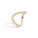 Gold ring with small diamonds on a white background
