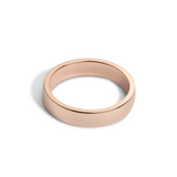 A 5mm wide, low-dome rose gold band ring with a high polish finish.